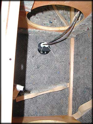 Inside of center chamber, binding post cup used for cable routing