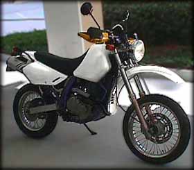 In the white with smaller front wheel, round headlight, IMS tank